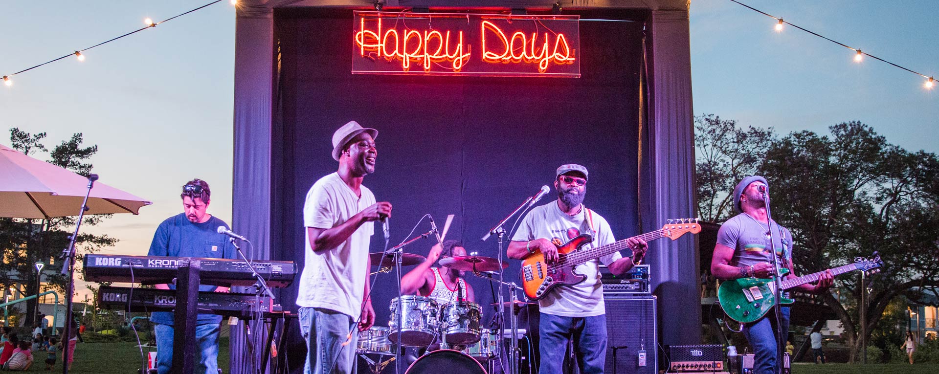 image of a band playing at an outdoor concert