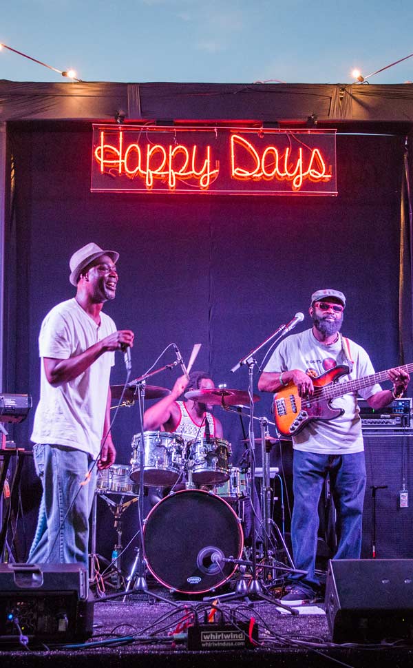 image of a band playing at an outdoor concert
